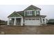 Exterior view of a two story home with white trim and a two car garage at 4055 Bozeman Way, Bargersville, IN 46106