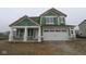 Exterior view of a two story home with white trim and a two car garage at 4055 Bozeman Way, Bargersville, IN 46106