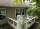 Lovely back deck with cozy seating provides a relaxing outdoor space and picturesque view at 4232 Parliament Way, Avon, IN 46123