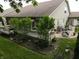Expansive backyard with lush landscaping, a deck, and a charming patio area at 4232 Parliament Way, Avon, IN 46123