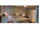 Comfortable bedroom with a queen size bed and a bedside table lamp on either side at 4232 Parliament Way, Avon, IN 46123