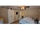 Bedroom with hard wood floor, a closet and a view into the bathroom at 4232 Parliament Way, Avon, IN 46123