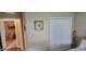 Bedroom features a double door closet and a view into another room at 4232 Parliament Way, Avon, IN 46123
