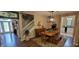 Bright and inviting dining area featuring a wooden table, stylish lighting, and staircase access at 4232 Parliament Way, Avon, IN 46123