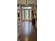 Inviting foyer featuring decorative front door, beautiful flooring, and stylish décor at 4232 Parliament Way, Avon, IN 46123