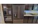 Modern kitchen appliances with matte finish and copper hardware, built into dark cabinetry at 4232 Parliament Way, Avon, IN 46123