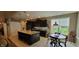 Kitchen with dark cabinets, granite countertops, and a large island with seating at 4232 Parliament Way, Avon, IN 46123