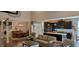 Open concept living room with a kitchen and dining area; great natural light at 4232 Parliament Way, Avon, IN 46123