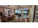 Open-concept living space featuring dining and kitchen areas with lovely flooring at 4232 Parliament Way, Avon, IN 46123