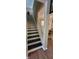Well-maintained staircase with contrasting black and white trim leading to upper level at 4232 Parliament Way, Avon, IN 46123