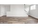 Bright living room features wood flooring and a staircase leading to the upper level at 449 Shade St, Carmel, IN 46290