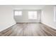 A bright living space features hardwood floors, recessed lighting, and large windows at 449 Shade St, Carmel, IN 46290
