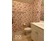 Bathroom with patterned wallpaper and a white vanity at 458 Burlington Ln, Carmel, IN 46032