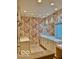 This bright bathroom features classic wallpaper and double sink vanity with ample counter space at 458 Burlington Ln, Carmel, IN 46032