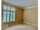 Bedroom with neutral walls and large window with natural light at 458 Burlington Ln, Carmel, IN 46032