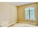 Bedroom with neutral walls and large window with natural light at 458 Burlington Ln, Carmel, IN 46032