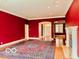 Elegant living room featuring a fireplace, hardwood floors and a patterned area rug at 458 Burlington Ln, Carmel, IN 46032