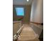 Carpeted stairs featuring a window above at 458 Burlington Ln, Carmel, IN 46032