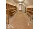 Large storage room features shelving units and a full-size refrigerator at 458 Burlington Ln, Carmel, IN 46032