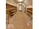 Large storage room features shelving units and a full-size refrigerator at 458 Burlington Ln, Carmel, IN 46032
