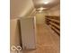 Large storage room features shelving units and a full-size refrigerator at 458 Burlington Ln, Carmel, IN 46032