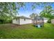 Backyard featuring lush green lawn and trampoline at 4747 Wellington Ave, Lawrence, IN 46226