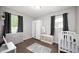 Bedroom featuring ample storage, gray accents, and natural light at 4747 Wellington Ave, Lawrence, IN 46226