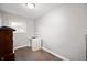 Small bedroom with neutral walls, wood floors, and lots of natural light at 4747 Wellington Ave, Lawrence, IN 46226