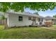 Charming one-story home featuring a landscaped yard, a cozy front porch, and inviting curb appeal at 4747 Wellington Ave, Lawrence, IN 46226