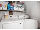 Laundry room with white front load washer and dryer at 4747 Wellington Ave, Lawrence, IN 46226