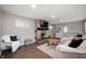 Cozy living room featuring a stone fireplace and comfortable seating at 4747 Wellington Ave, Lawrence, IN 46226