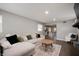 Relaxing living room with a large sectional sofa and stylish decor at 4747 Wellington Ave, Lawrence, IN 46226
