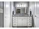 Bathroom vanity includes white cabinetry and a granite countertop at 478 Firefly Ln, Carmel, IN 46032