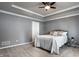 Bedroom features a decorative ceiling and carpeted flooring at 478 Firefly Ln, Carmel, IN 46032