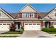 Charming townhome featuring a two-car garage, manicured landscaping, and a well-maintained facade at 478 Firefly Ln, Carmel, IN 46032