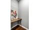 Hallway featuring a modern wooden table and beautiful floral artwork on the wall at 478 Firefly Ln, Carmel, IN 46032