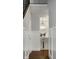 Hallway featuring hardwood floors, white wainscoting, and a glimpse of the dining room at 478 Firefly Ln, Carmel, IN 46032