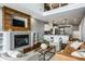 Spacious living area with a fireplace, hardwood floors, and an open floor plan at 478 Firefly Ln, Carmel, IN 46032