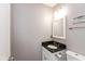Powder room featuring a granite-topped vanity and modern fixtures and white walls at 4965 Hawthorne Way, Avon, IN 46123