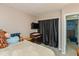 Carpeted bedroom featuring a closet with blackout curtains and soft stuffed animals at 4965 Hawthorne Way, Avon, IN 46123