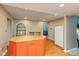 Bright kitchen featuring a wooden island, butcher block countertop, and modern refrigerator, plus hardwood flooring at 4965 Hawthorne Way, Avon, IN 46123