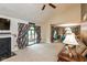 Cozy living room featuring a fireplace, plush carpet, and ample natural light from sliding glass doors at 4965 Hawthorne Way, Avon, IN 46123