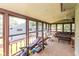 Bright sunroom with large windows and ample space for relaxation and fitness equipment at 4965 Hawthorne Way, Avon, IN 46123