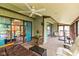 Spacious sunroom with ceiling fan and comfortable seating, perfect for relaxation at 4965 Hawthorne Way, Avon, IN 46123