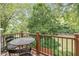Outdoor balcony features a metal table and chairs, offering serene river views and a peaceful outdoor retreat at 5108 Riverview Dr, Indianapolis, IN 46208