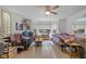 Bright bedroom featuring tile flooring, a ceiling fan, and a large window at 5108 Riverview Dr, Indianapolis, IN 46208
