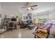 Bright bedroom featuring tile flooring, a ceiling fan, and a large window at 5108 Riverview Dr, Indianapolis, IN 46208