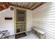 Charming front porch with a screen door and a bench seat at 5108 Riverview Dr, Indianapolis, IN 46208