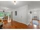 Bright hallway featuring hardwood floors and an open floor plan at 5108 Riverview Dr, Indianapolis, IN 46208