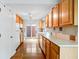 Well-lit kitchen features wooden cabinets and a functional layout, blending style and practicality for cooking at 5108 Riverview Dr, Indianapolis, IN 46208